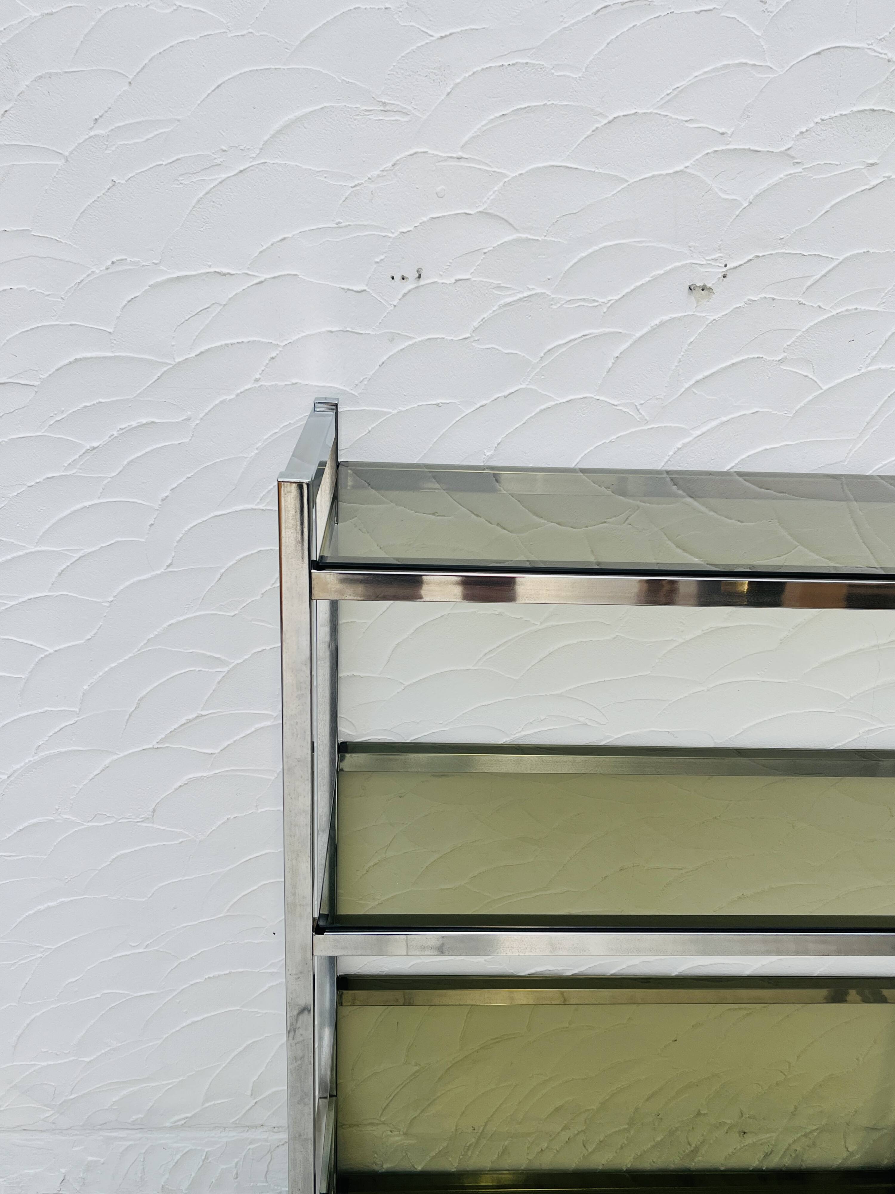 Chrome and smoked glass shelf in Italian 1970s style.