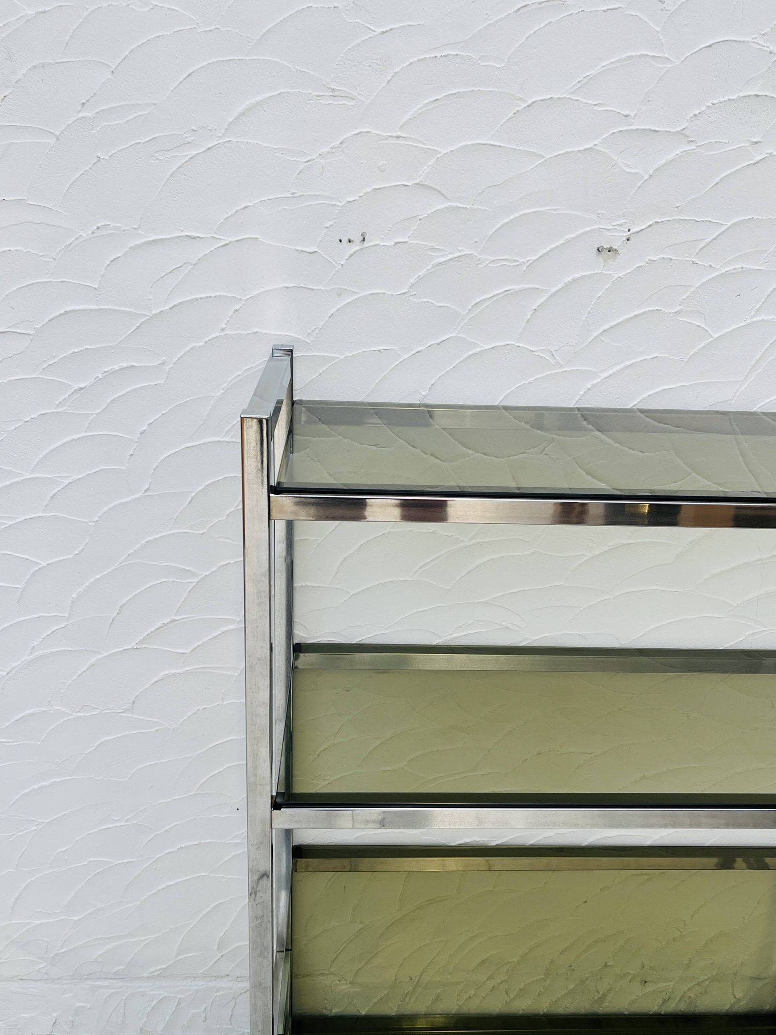 Chrome and smoked glass shelf in Italian 1970s style.