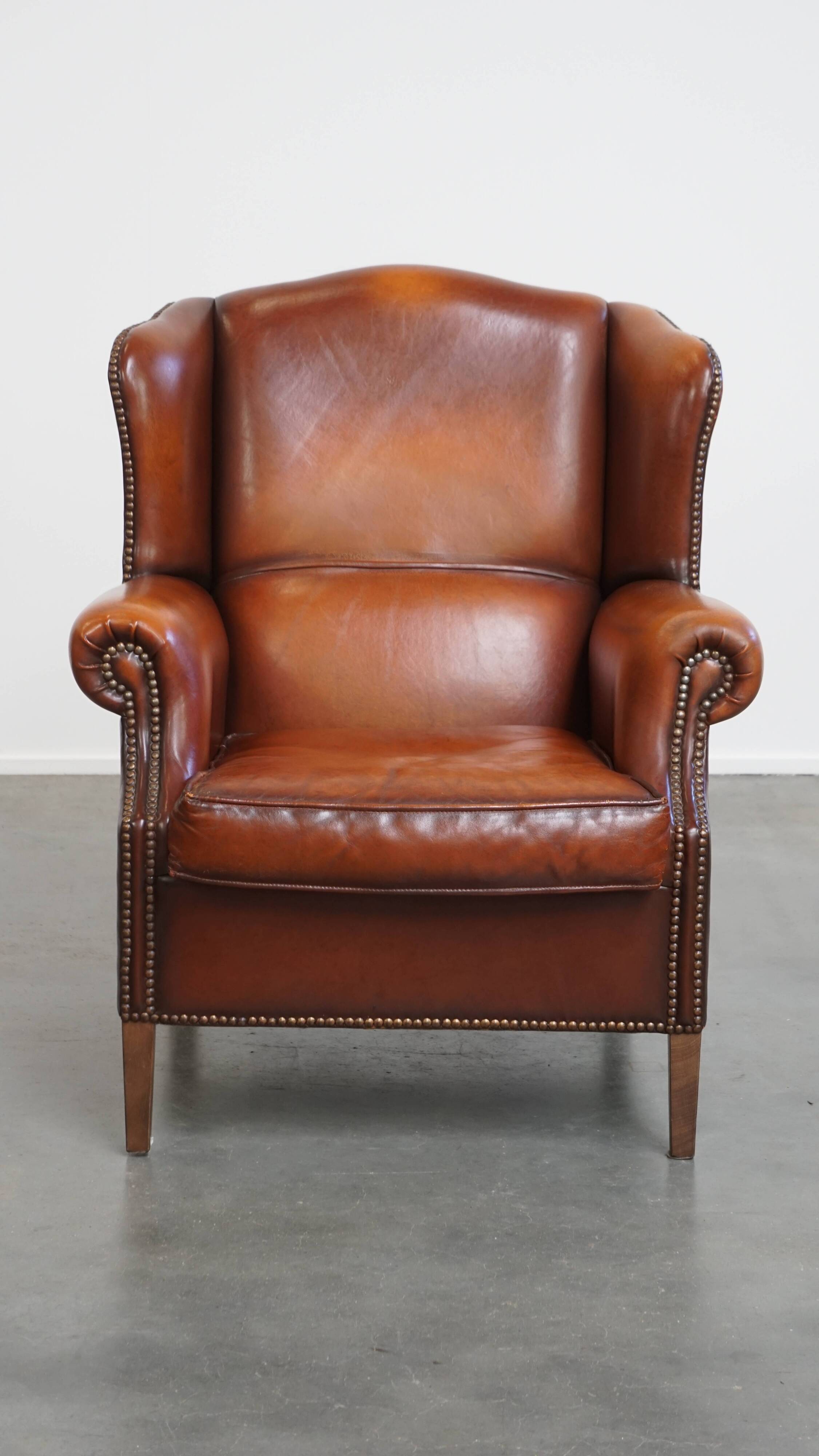 Fauteuil à oreilles en cuir de mouton