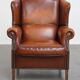 Fauteuil à oreilles en cuir de mouton
