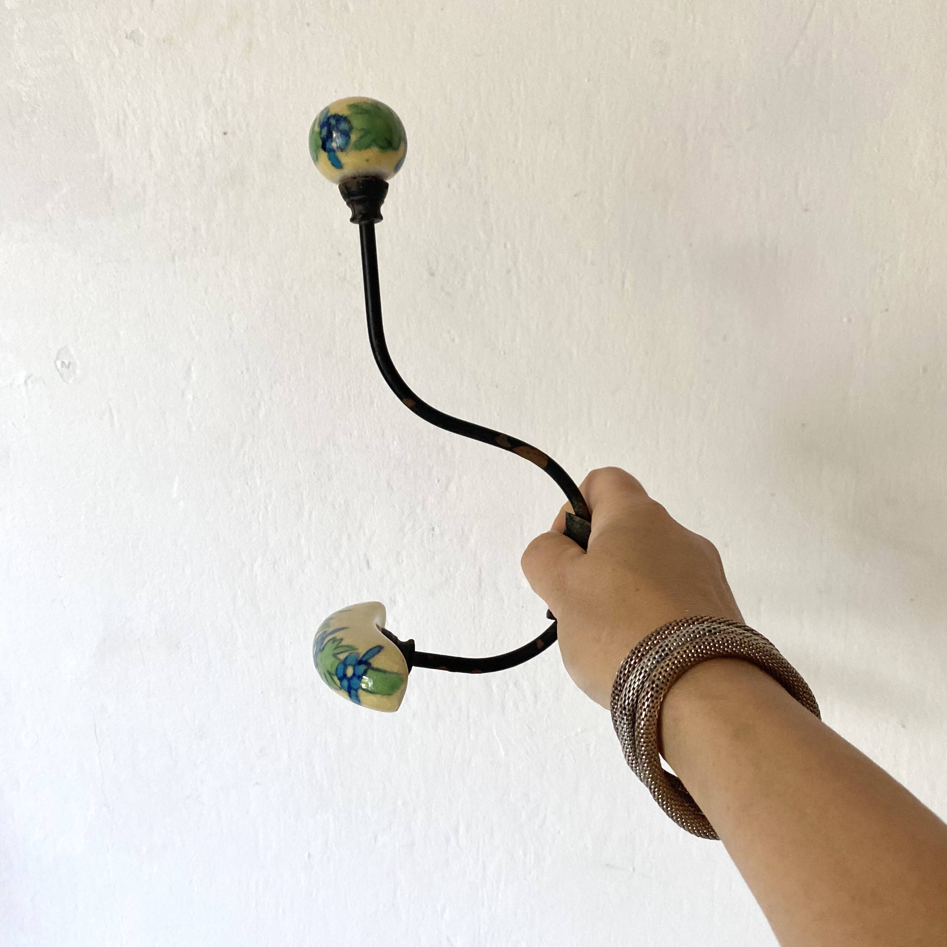Metal and flowered ceramic coat hooks