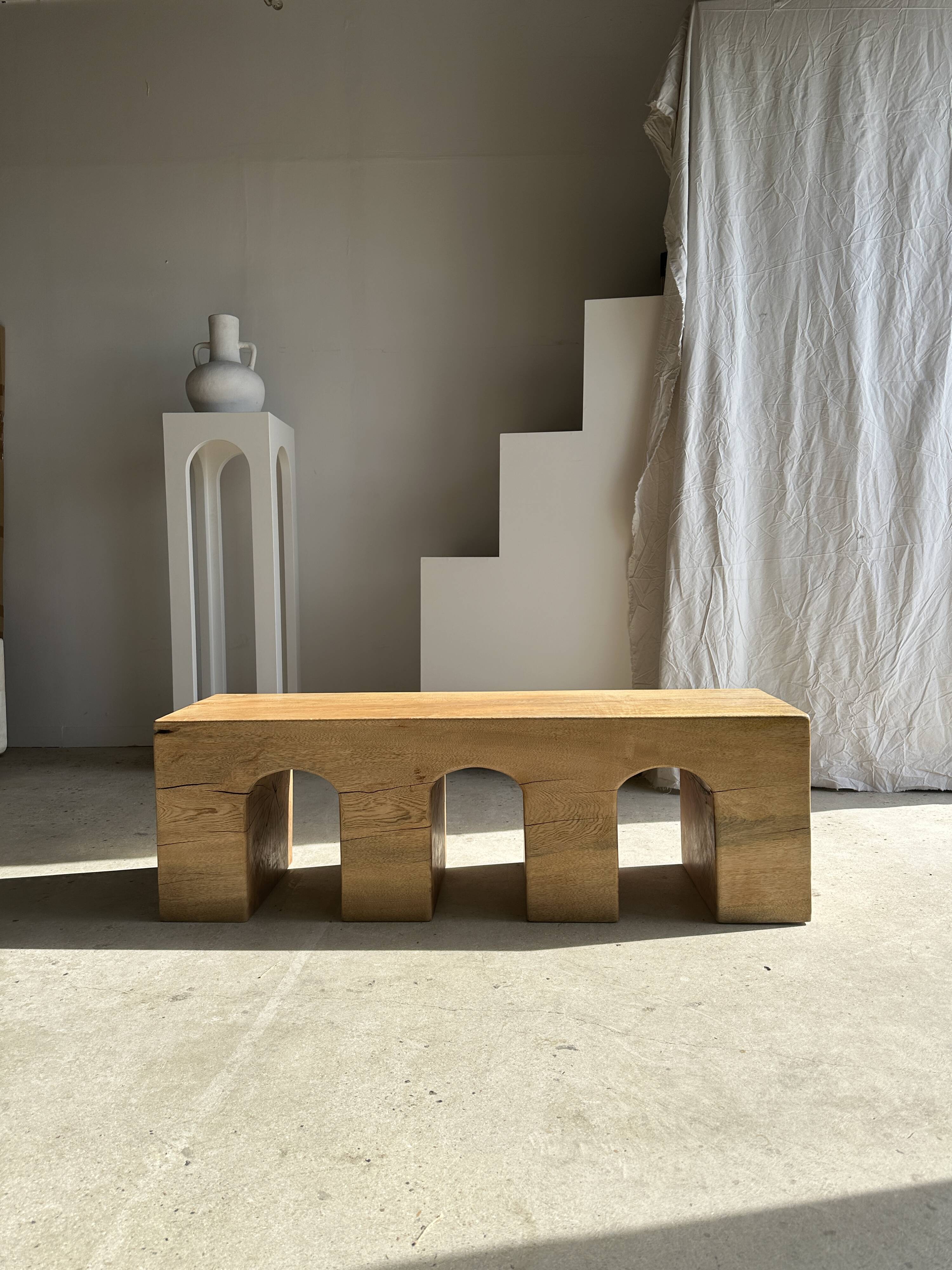 Solid monoxyl wood bench with carved 3-arch base - Natural wood color