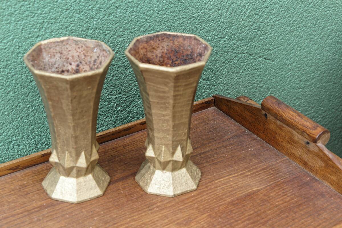Pair of cast iron cone vases, art deco