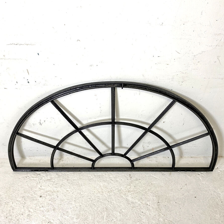 Old arched anthracite grey window