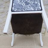 Voltaire style armchair covered in floral fabric in quality aged wood