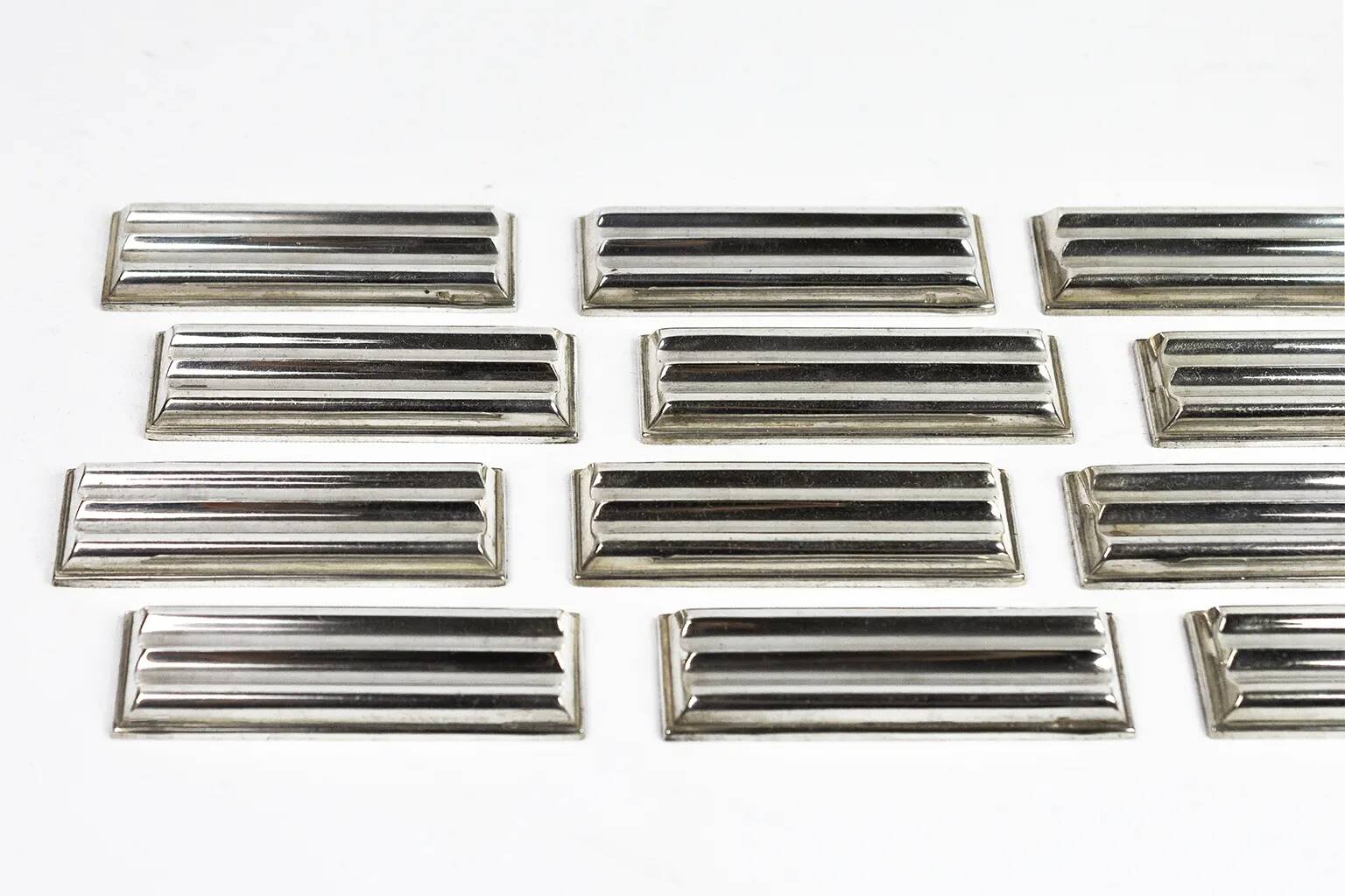 Christofle — 12 “Ondulations” knife rests by Luc Lanel, silver-plated metal