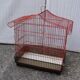 Old red metal birdcage