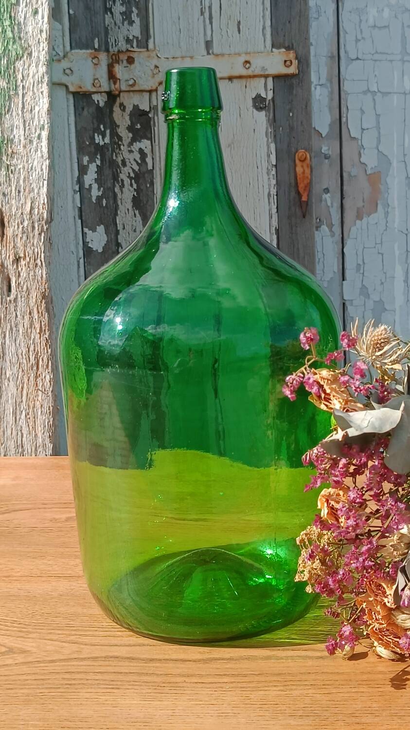 Superb antique green glass demijohn.