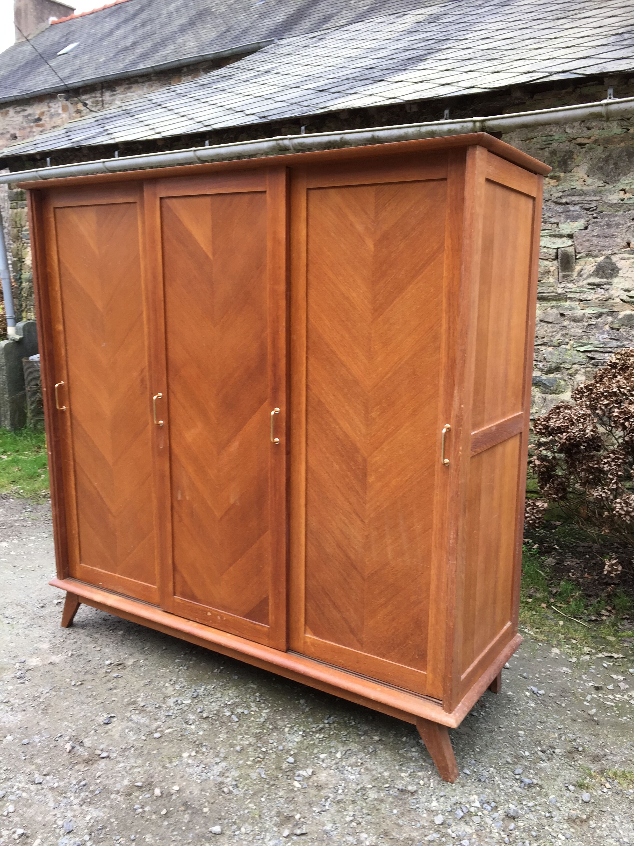 Vintage wardrobe compass feet with 3 sliding oak doors.