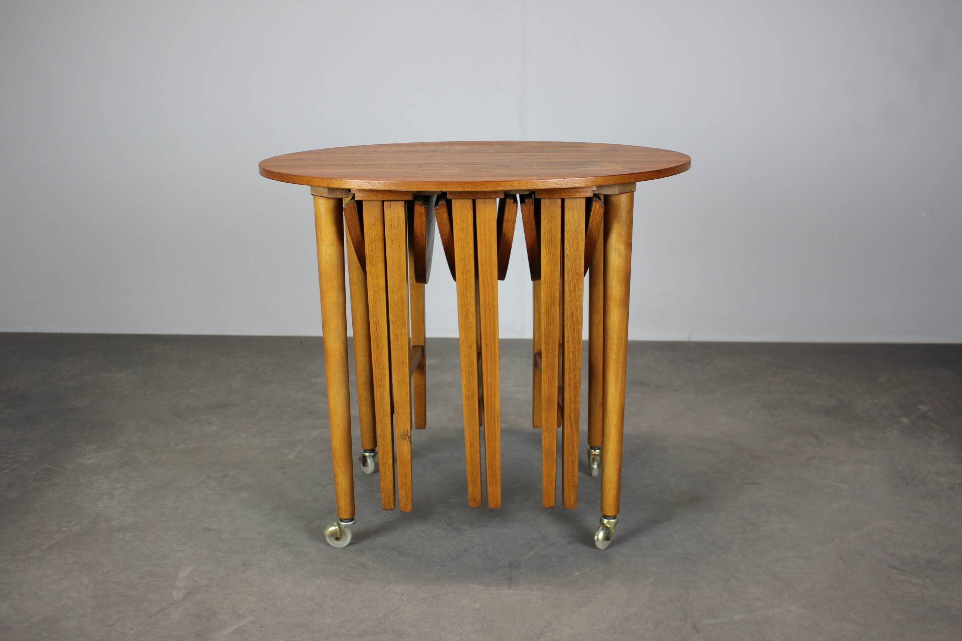 Restored Danish folding teak table with three nesting chairs by Poul Hundevad