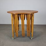 Restored Danish folding teak table with three nesting chairs by Poul Hundevad
