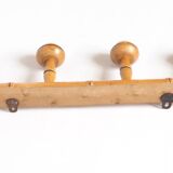 Light wood coat hooks 1900