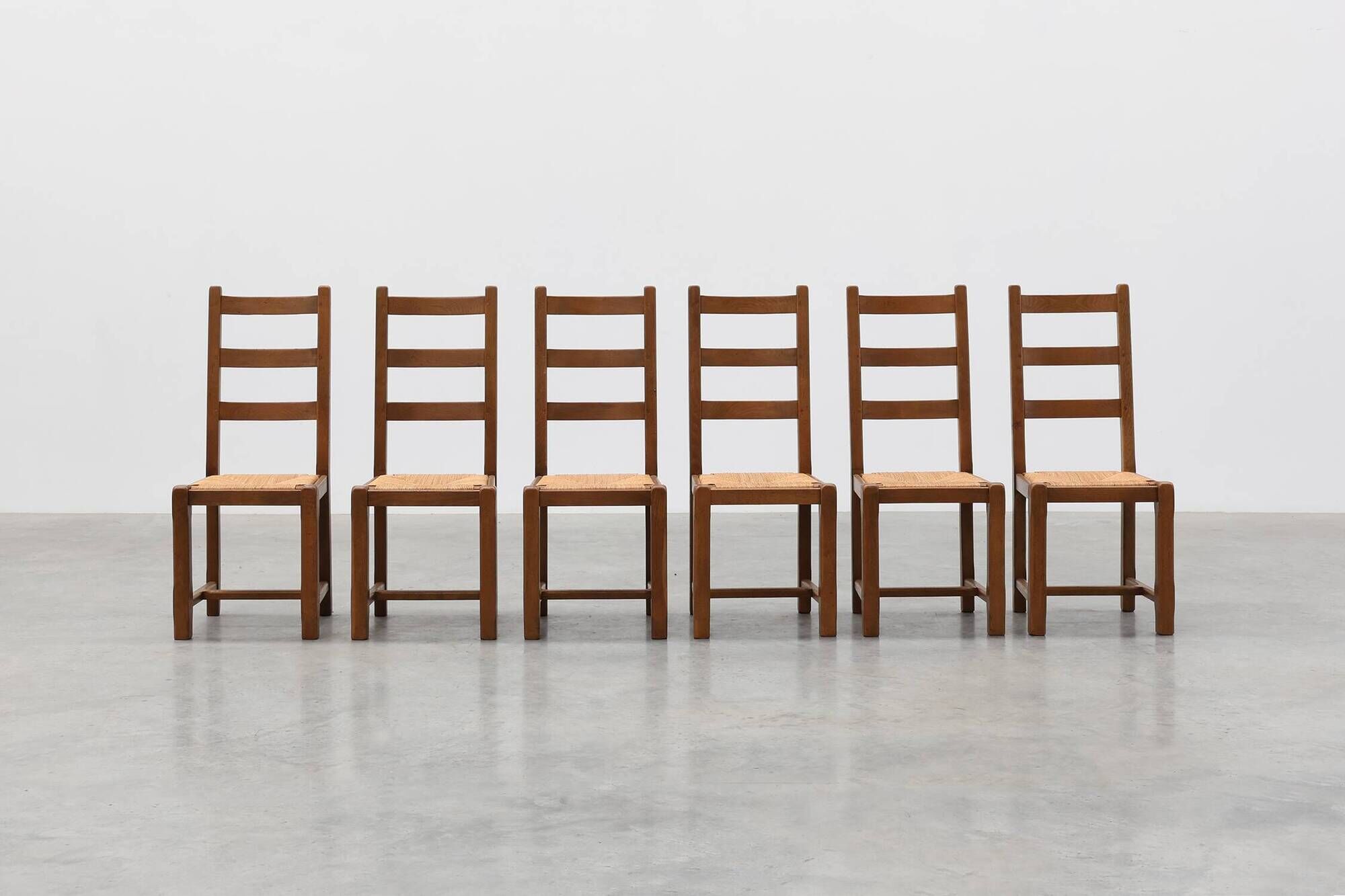 Set of 6 rustic oak ladder-back chairs with rush seats, France, 20th centur