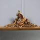 Antique Rococo-style mirror in carved gilded wood, 20th century.