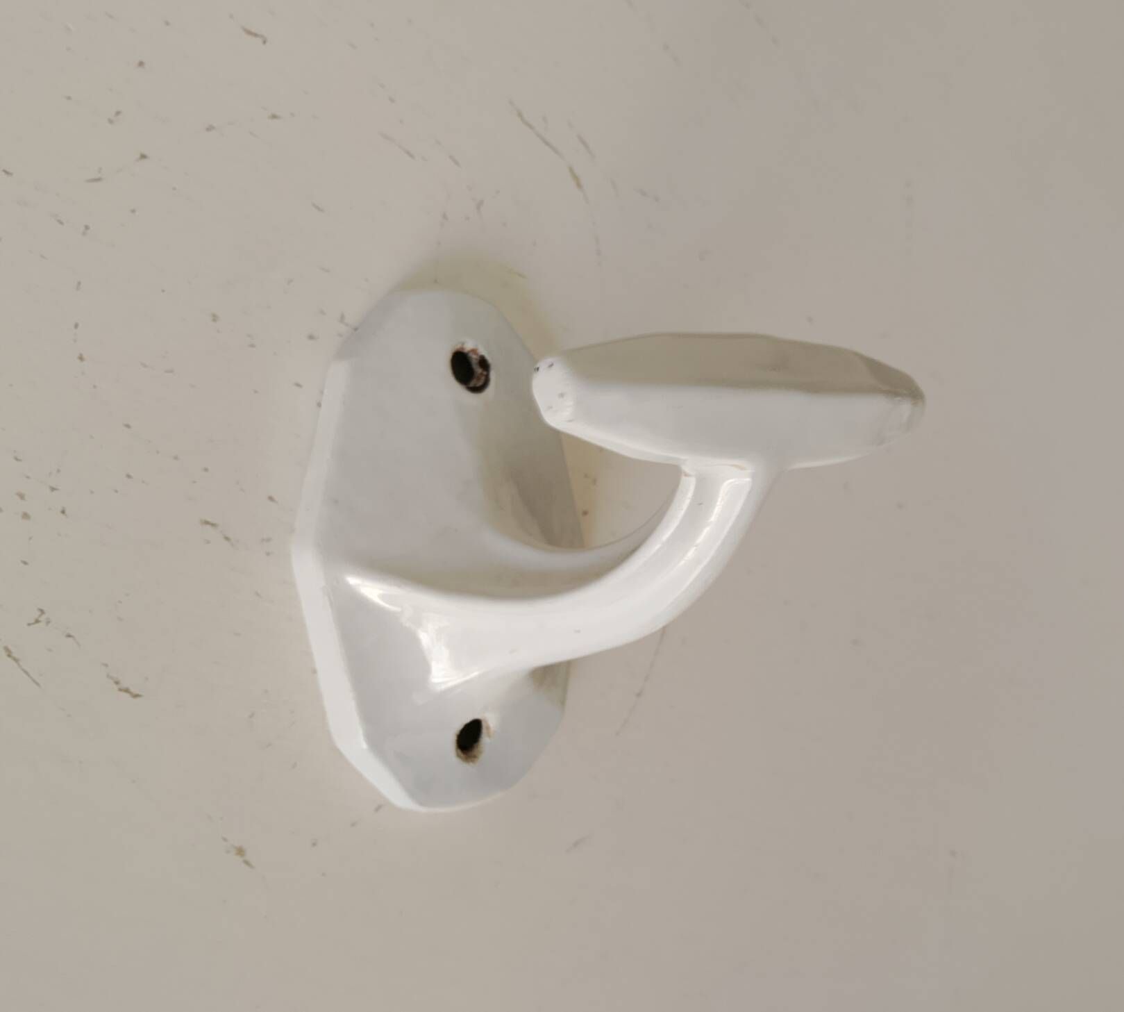 Antique Art Deco wall coat hook in enamelled cast iron.