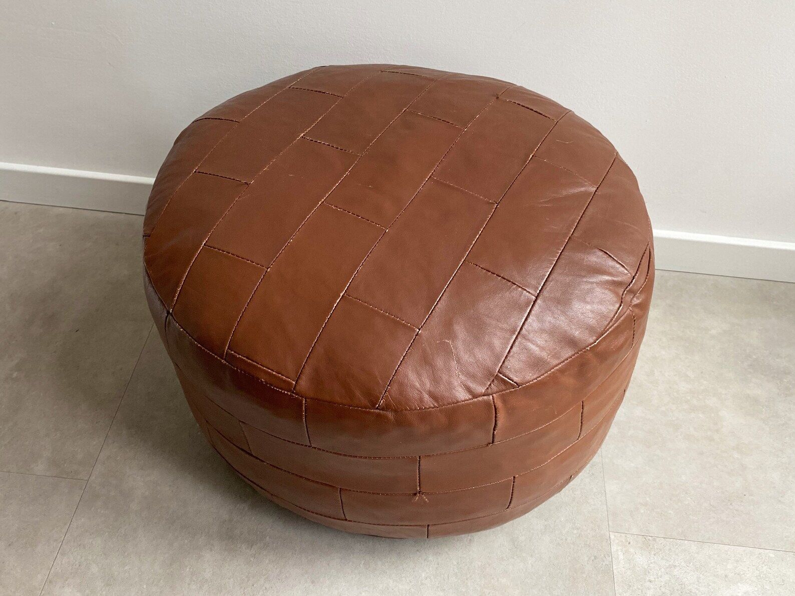 Vintage brown patchwork round leather ottoman / poof / bench