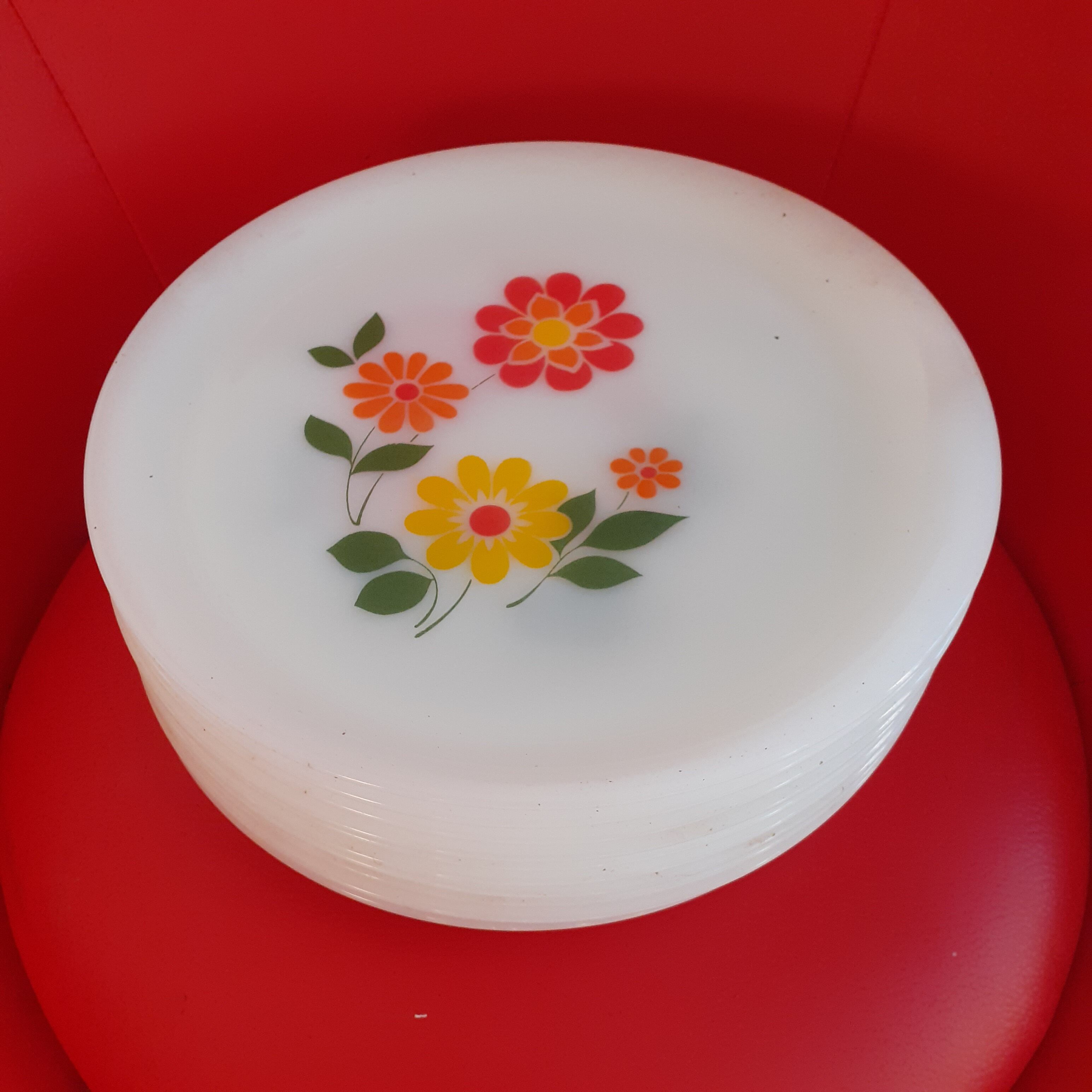 11 arcopal opaline plates. floral pattern.