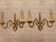 Pair of bronze wall lights with 2 arms in "Dutch" style.