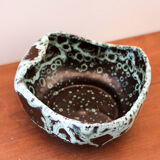 Empty pocket in black ceramic with green drip