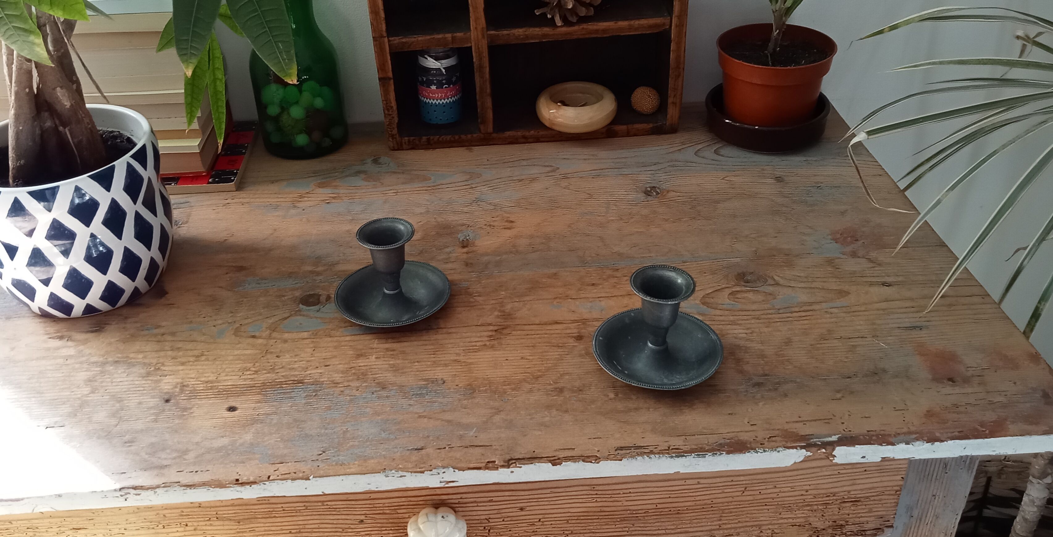 Pair of antique pewter candle holders