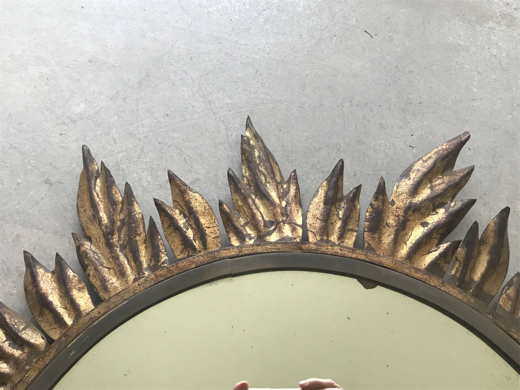 Sun mirror decorated with golden leaves, circa 1950.