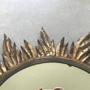 Sun mirror decorated with golden leaves, circa 1950.