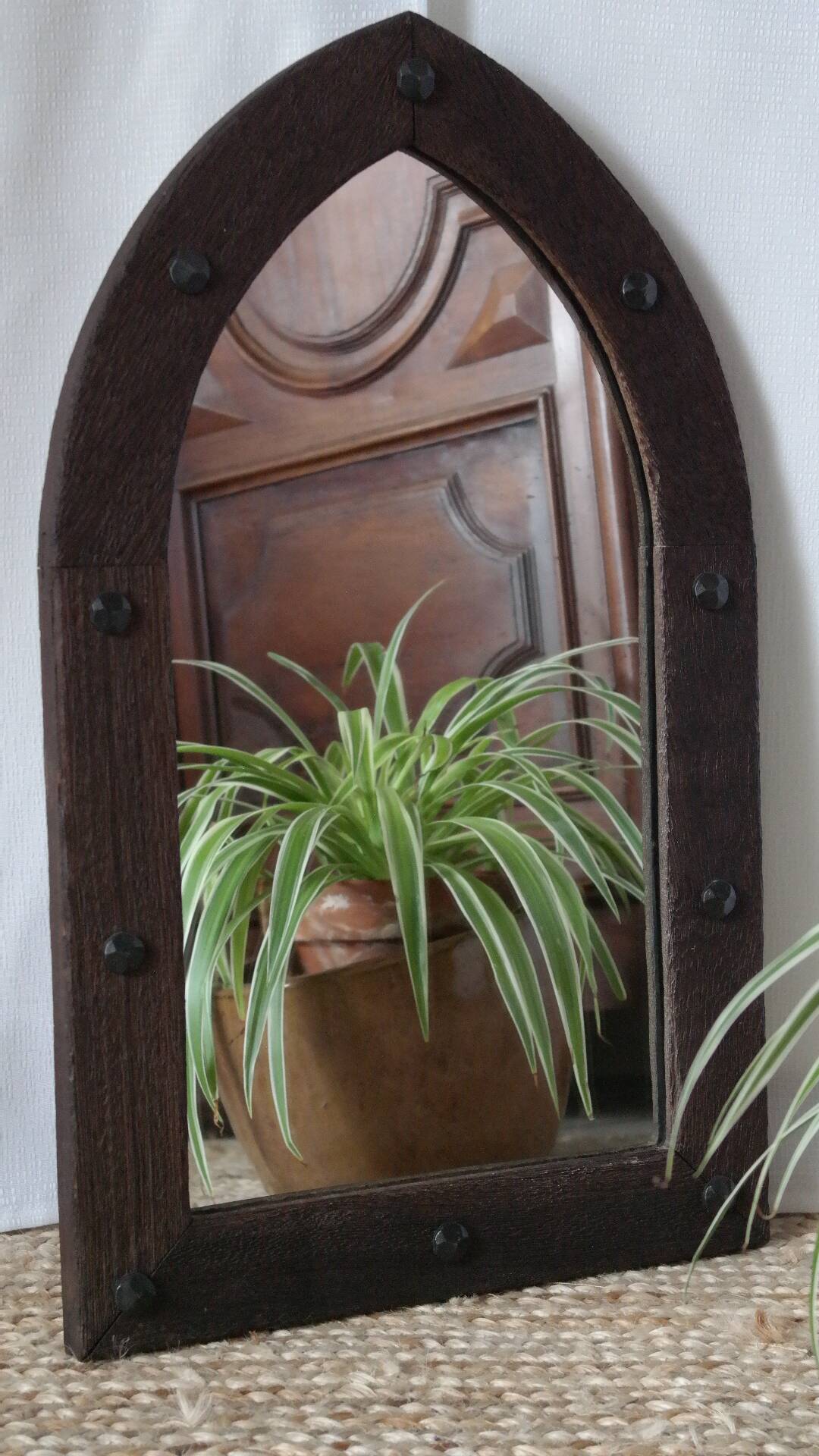 Old handcrafted Gothic style wooden mirror