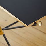 Black glass and brass coffee table in the 1960s