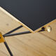 Black glass and brass coffee table in the 1960s