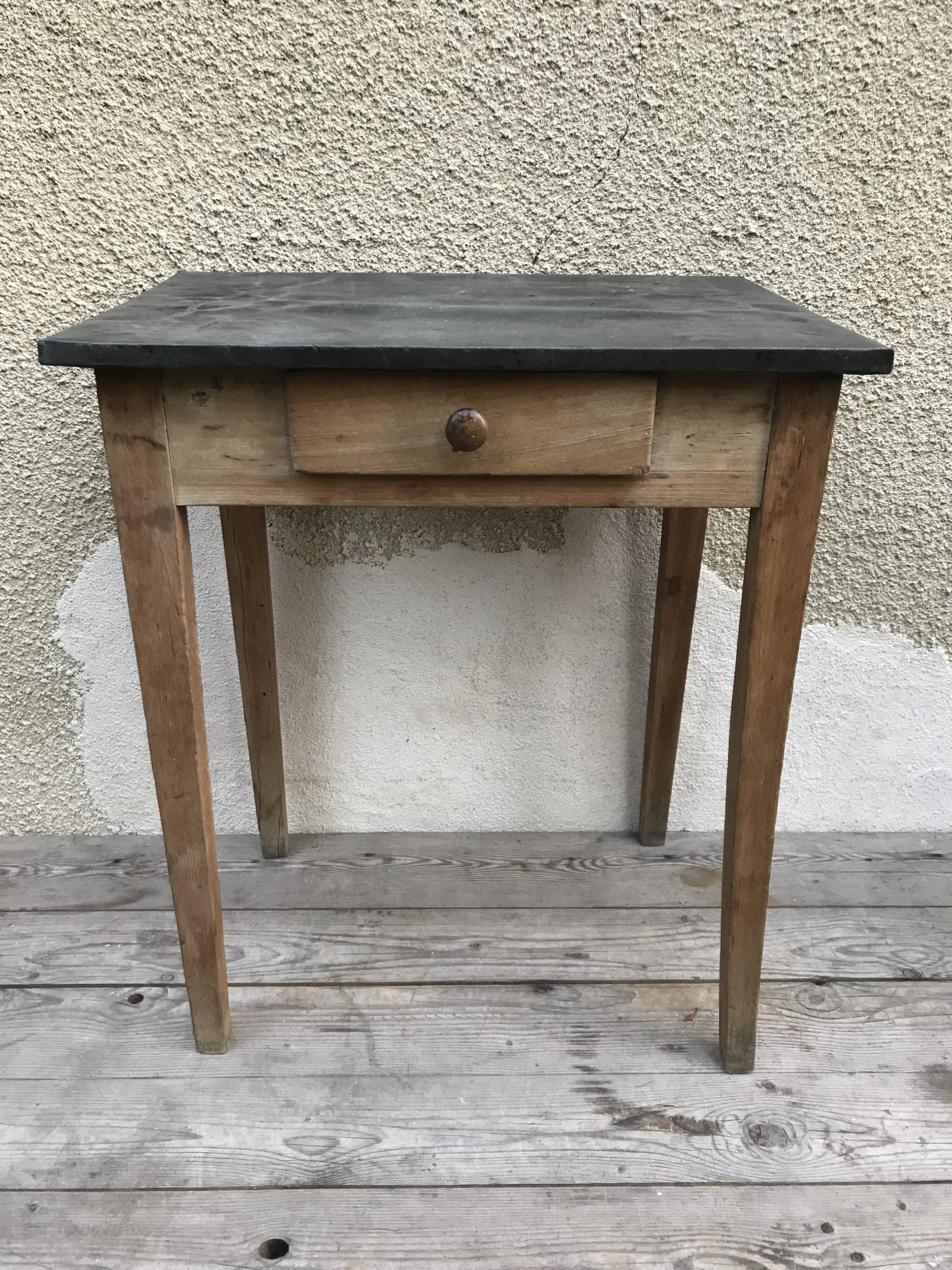 Old kitchen table in wood with compass feet