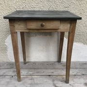 Old kitchen table in wood with compass feet