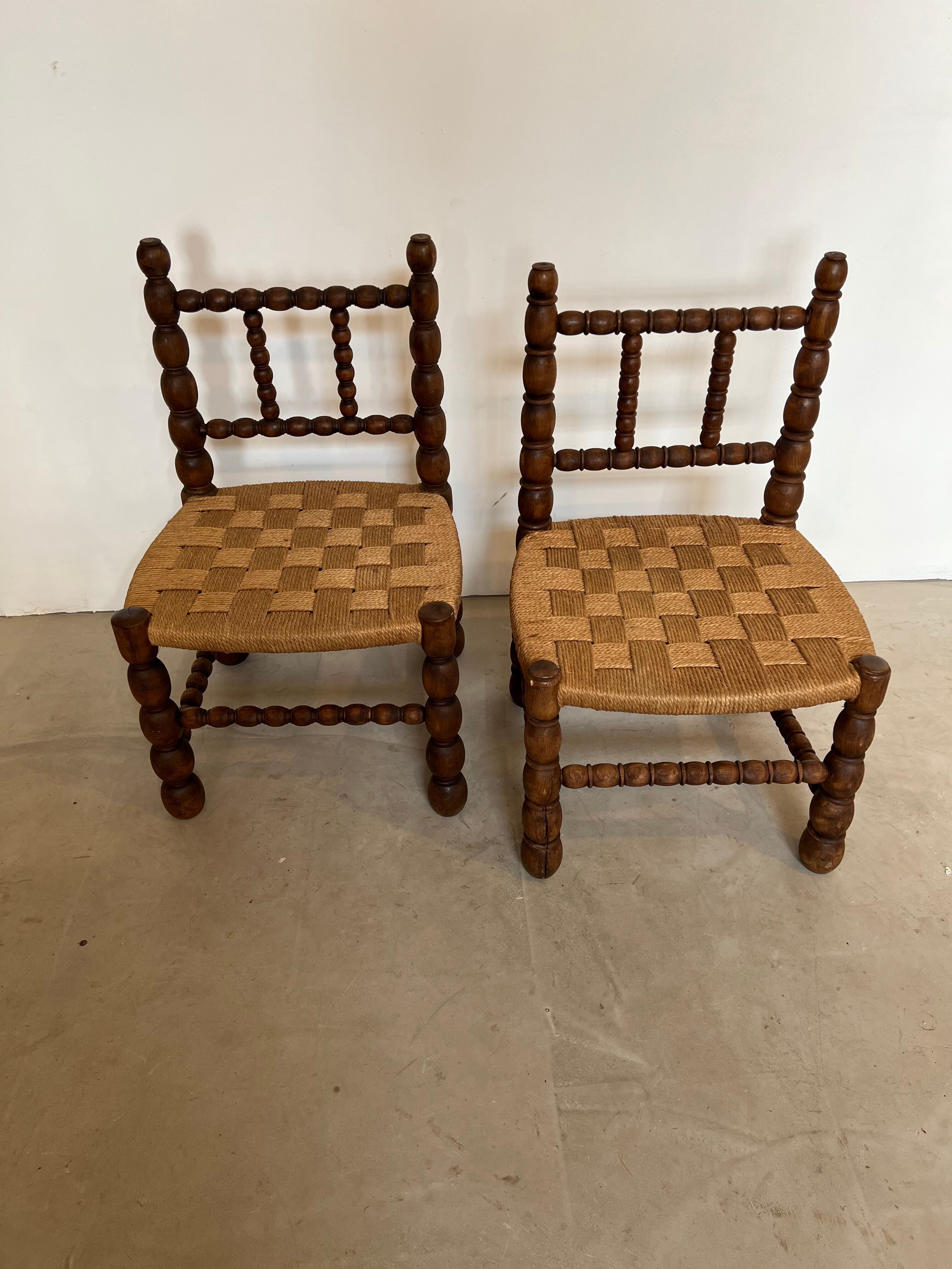 Pair of low chairs in turned wood