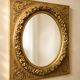 Large Louis XVI style mirror in gilded wood and composition – Early 20th century.