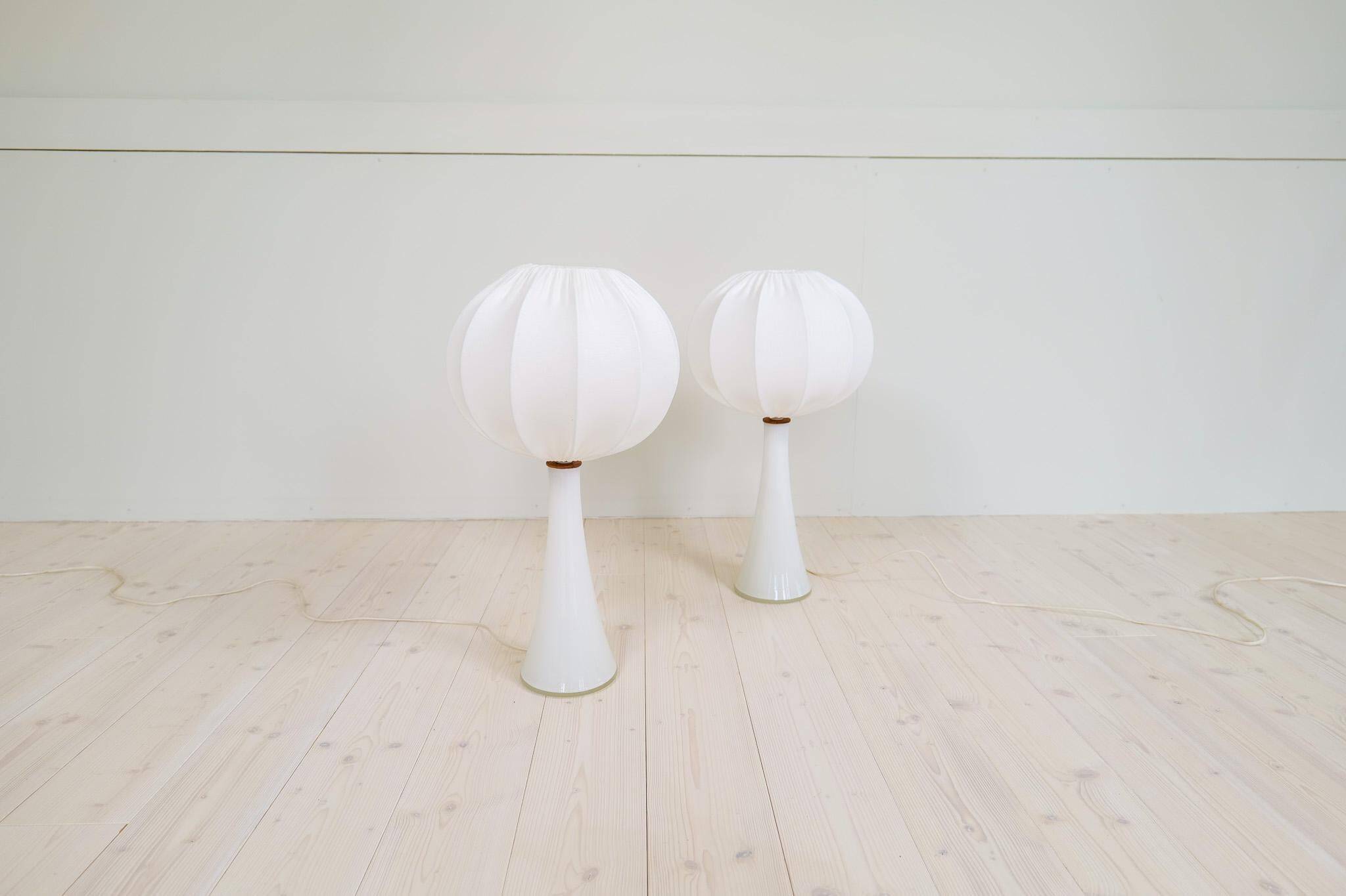 Pair of mid-century opaline glass table lamps with cotton shades by Bergboms, Sweden, 1960.