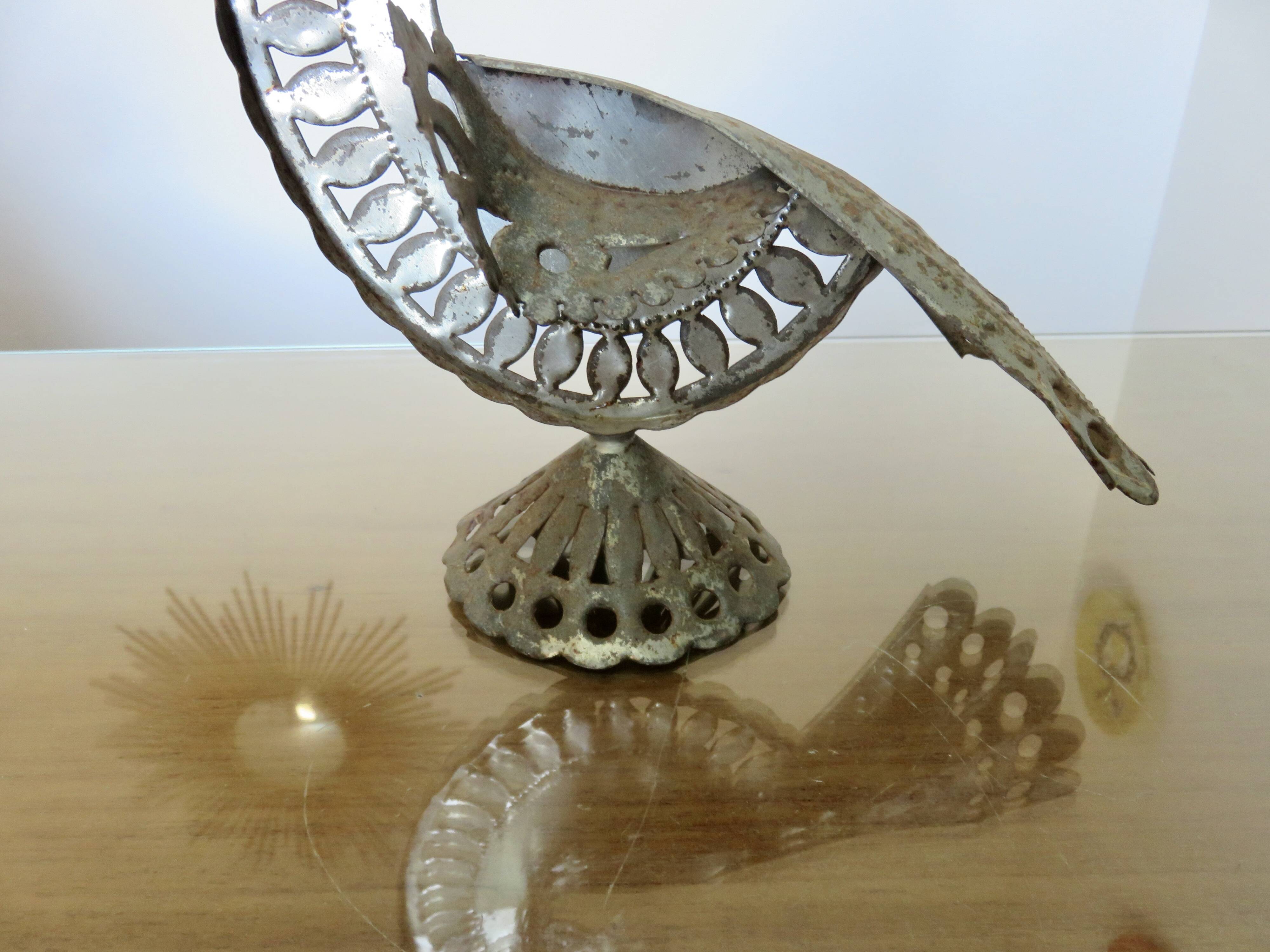 metal sculpture in sheet metal representing a peacock, work from the 1960s