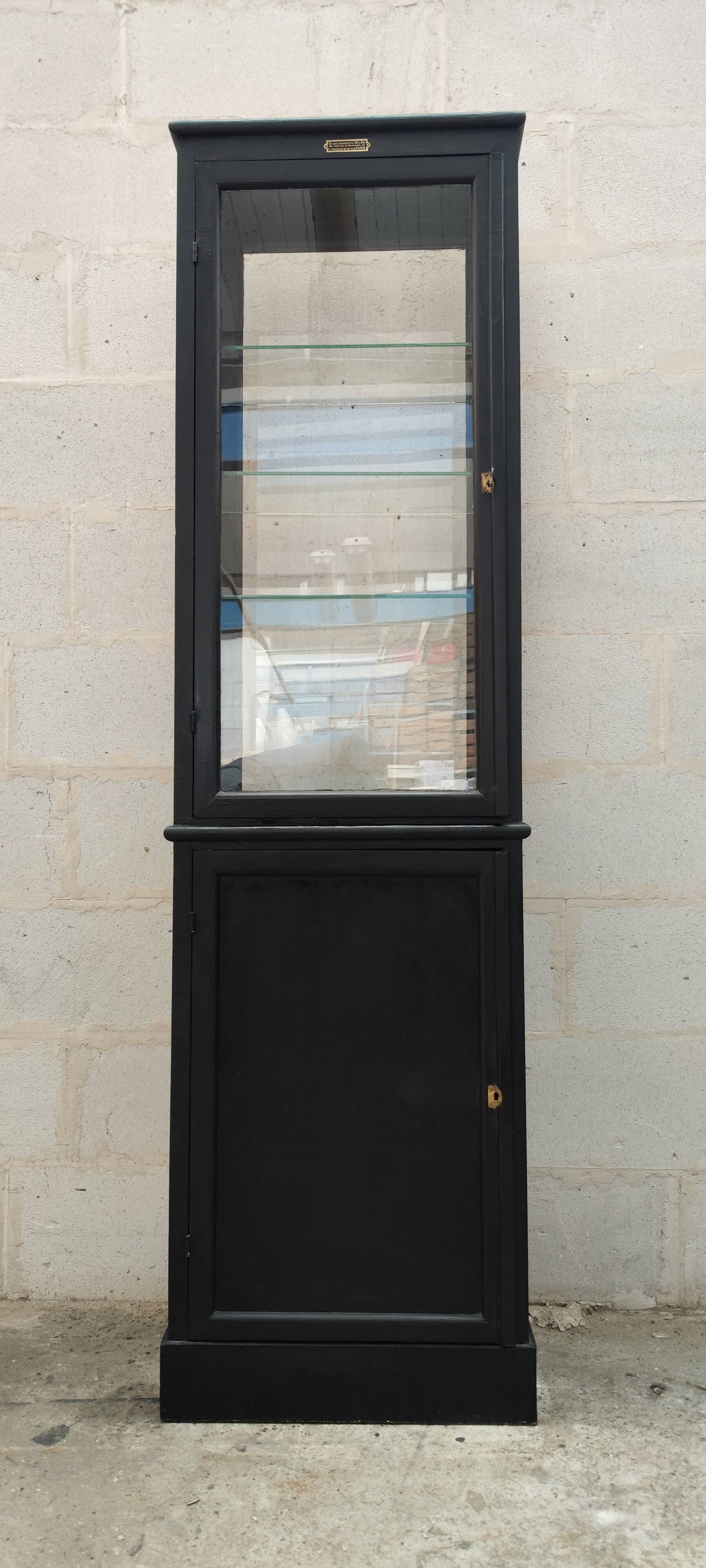 Old two-door shop showcase with black patina