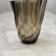 Small translucent dark brown twisted glass vase