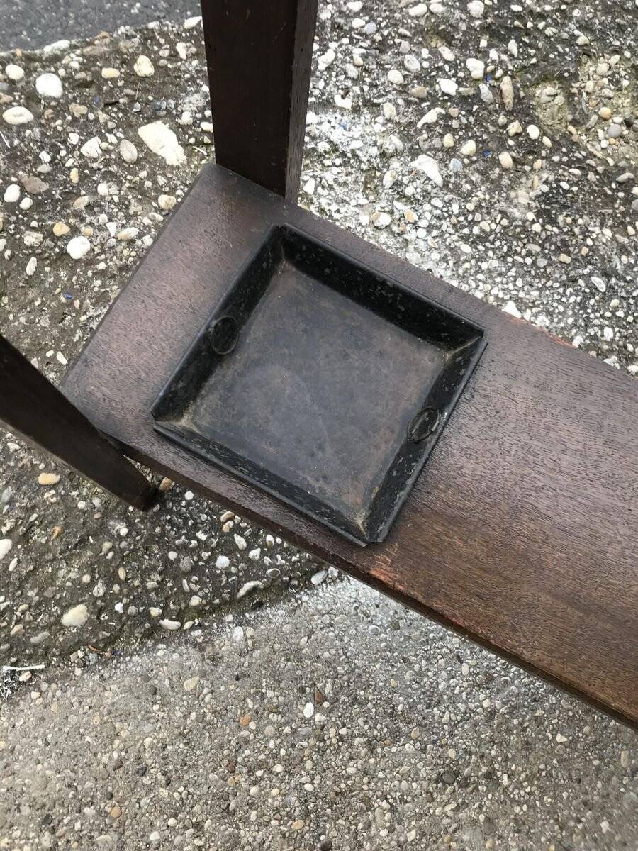Antique brown wooden coat rack with mirror and umbrella stand, 1900 style.