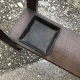 Antique brown wooden coat rack with mirror and umbrella stand, 1900 style.