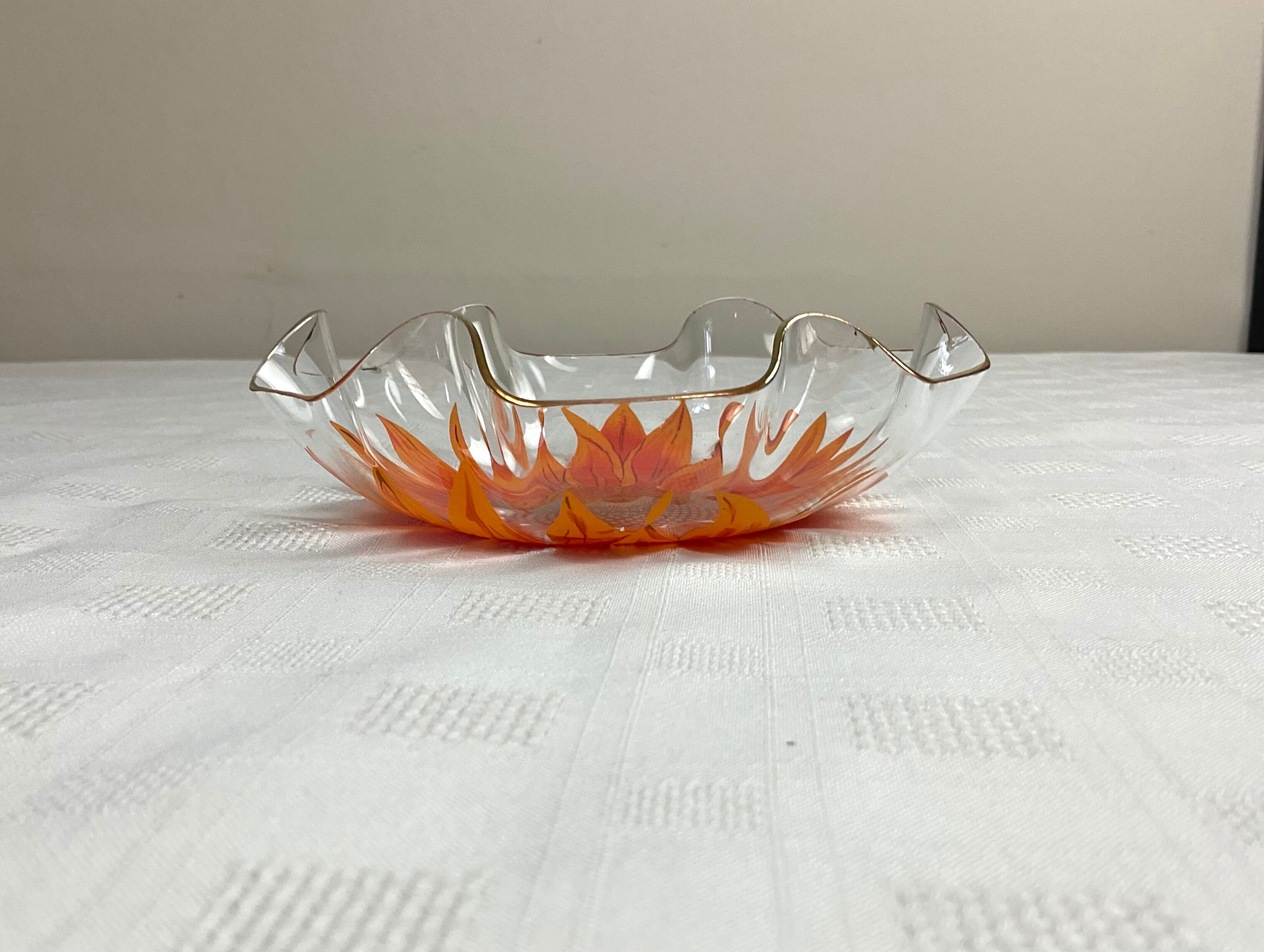 Glass cup with orange sunflower