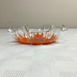 Glass cup with orange sunflower