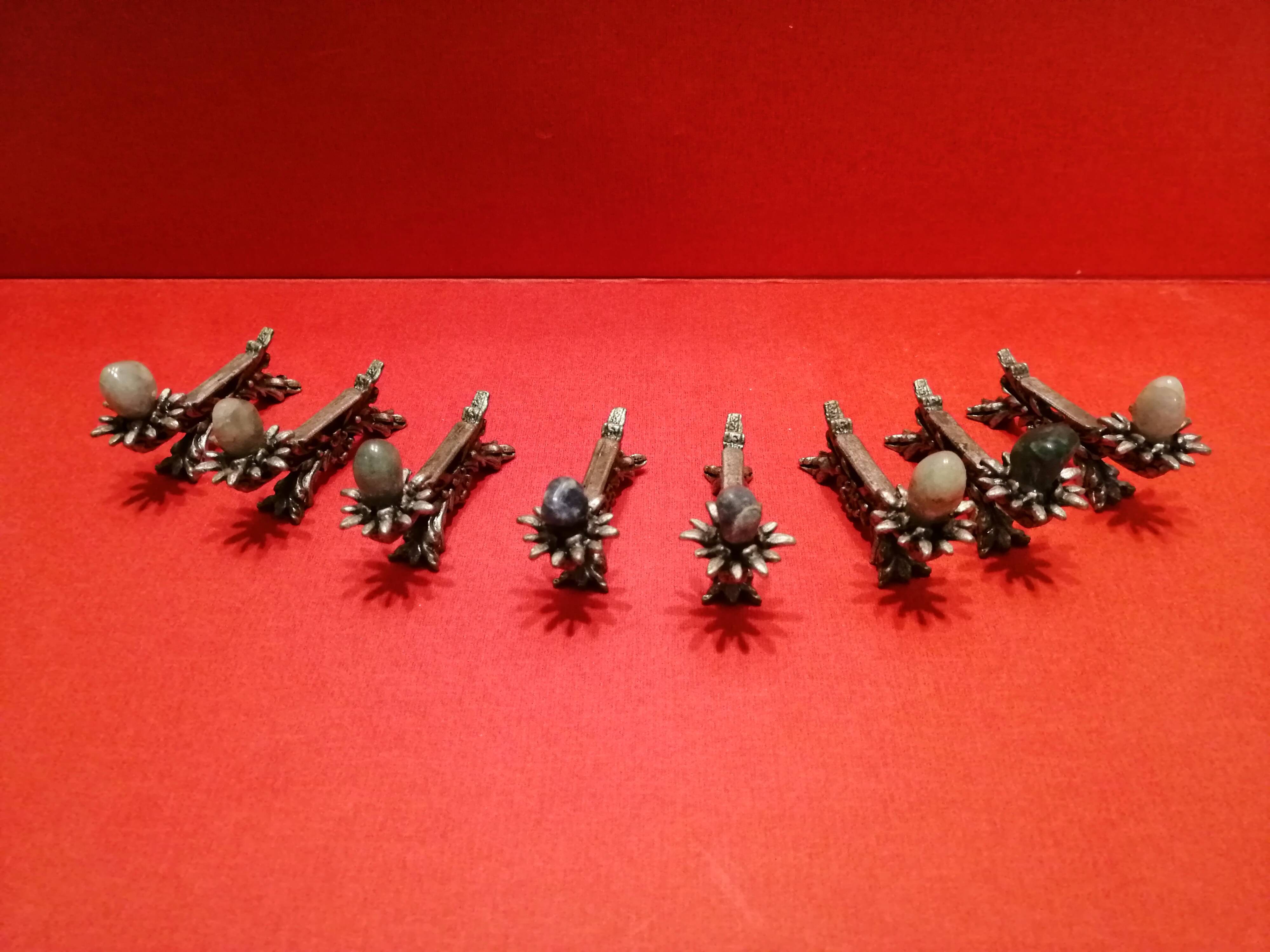 Set of 8 metal knife doors decorated with a stone