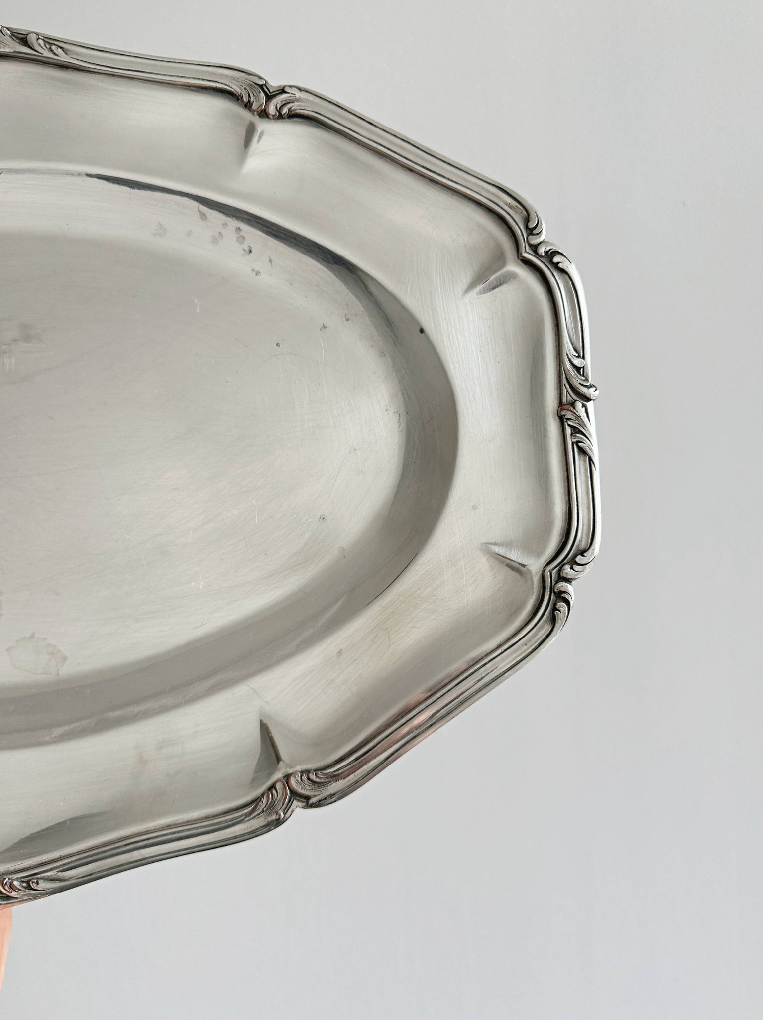 oval silver metal plate