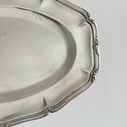 oval silver metal plate