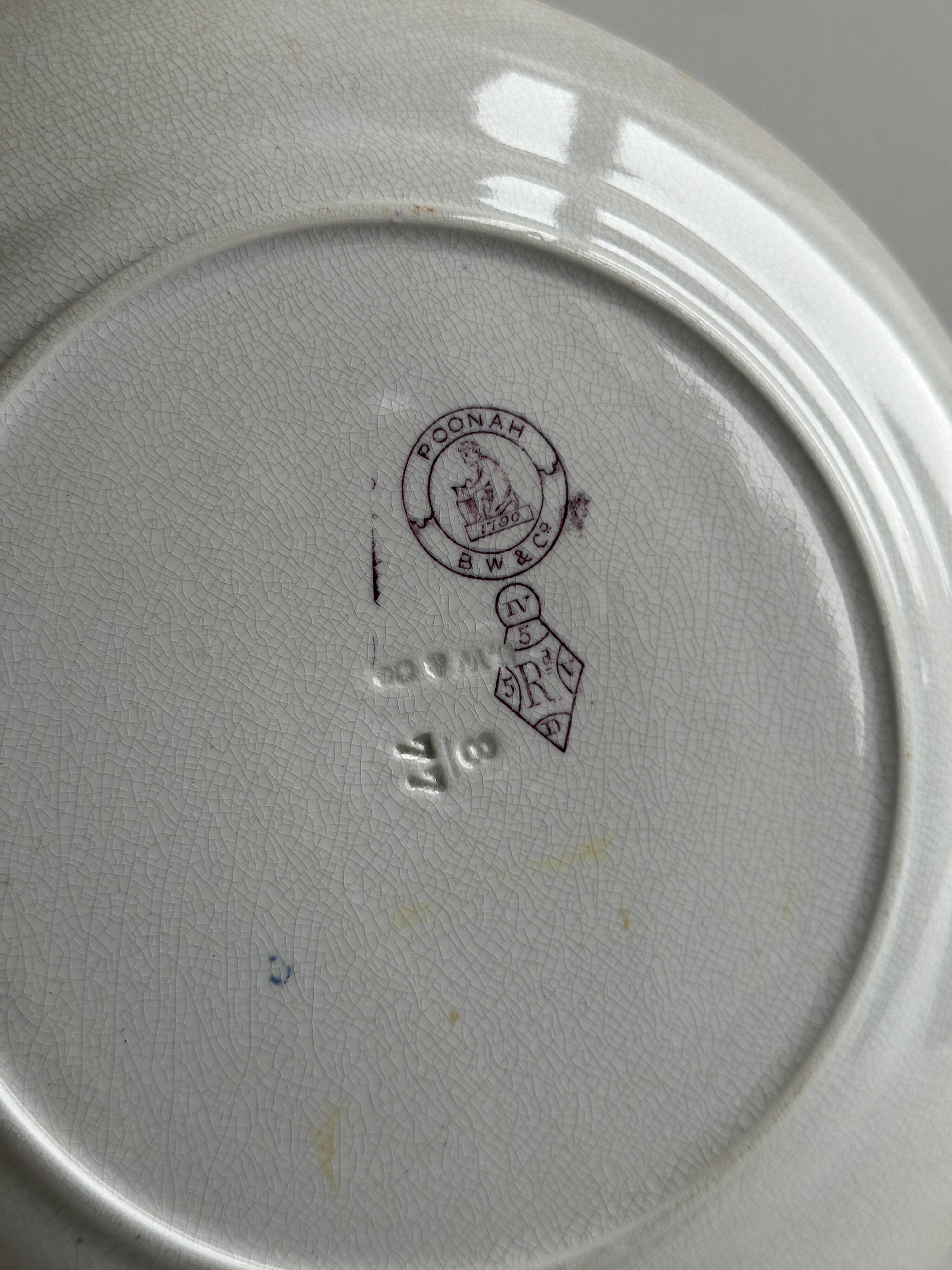 Antique plate with purple oriental decoration
