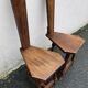 2 three-legged chairs made of solid wood
