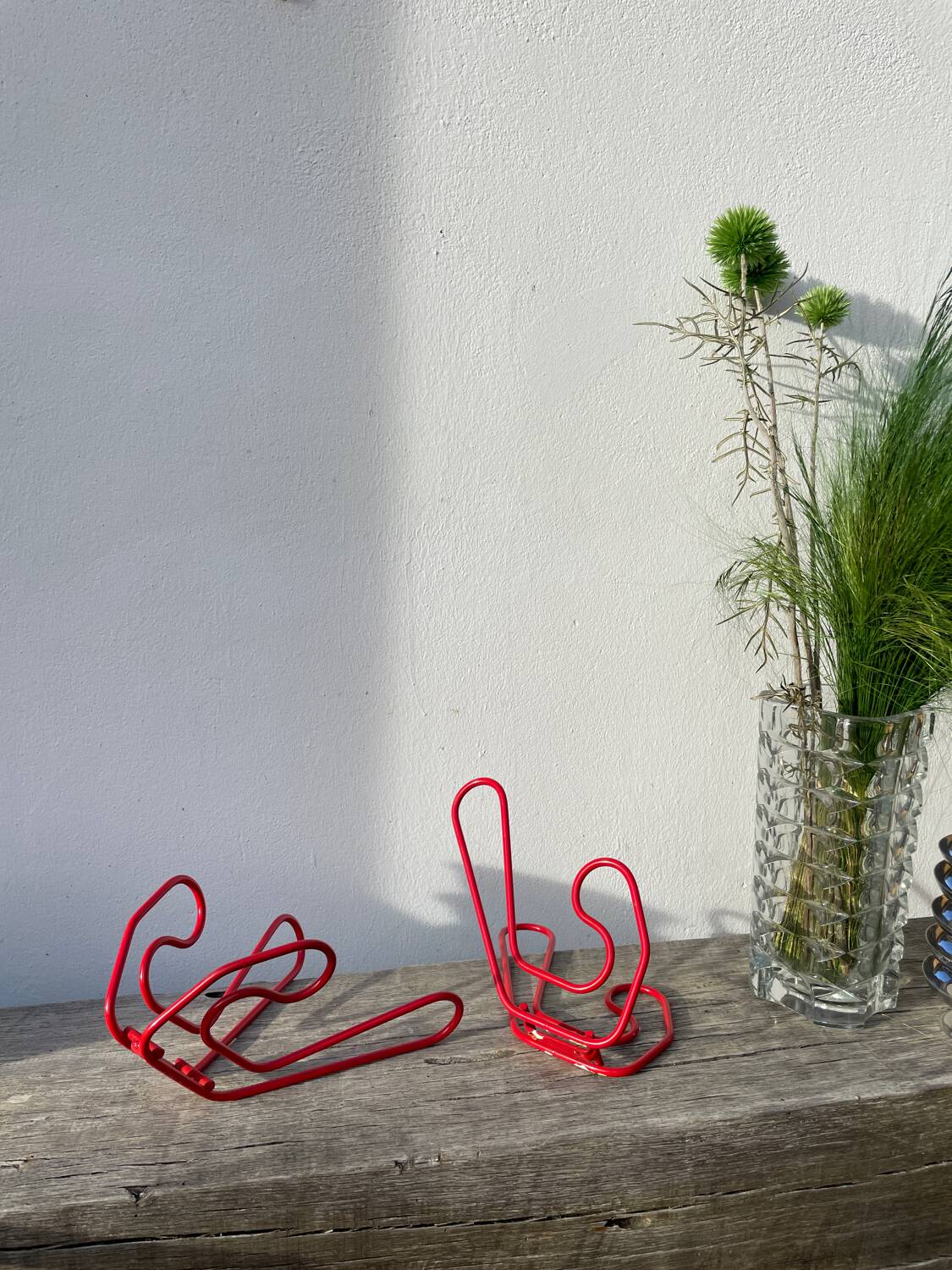 Pair of red metal wall hooks