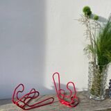 Pair of red metal wall hooks