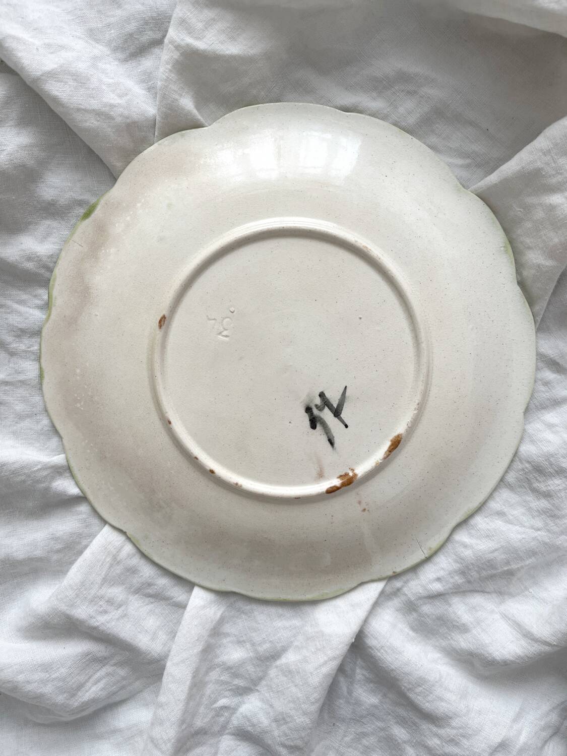 Antique plate in barbotine grapes and vine leaves from Orchies