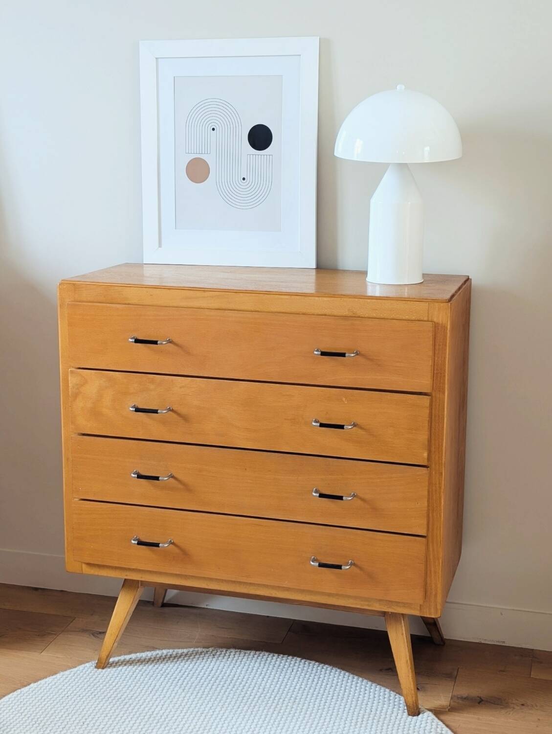 Vintage chest of drawers with tapered legs from the 1960s.